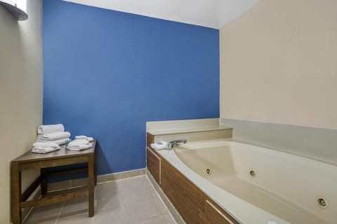 Suite, 1 King Bed, Non Smoking, Jetted Tub (with Sofabed) | Bathroom | Combined shower/tub, free toiletries, hair dryer, towels