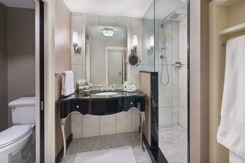 Combined shower/tub, designer toiletries, hair dryer, slippers