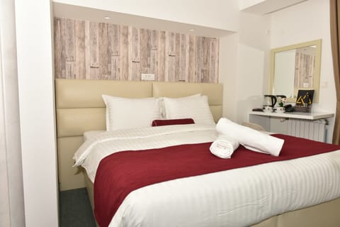 Economy Double Room, 1 Queen Bed, Balcony, City View | Premium bedding, minibar, desk, blackout drapes