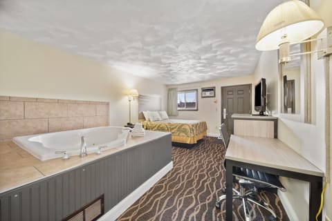 Suite, 1 Queen Bed, Jetted Tub | Premium bedding, desk, blackout drapes, free WiFi