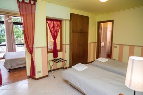 Basic Quadruple Room | Desk, blackout drapes, free WiFi, bed sheets