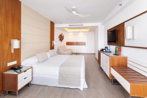 Family Room, Balcony, Garden View | Minibar, in-room safe, free WiFi, bed sheets