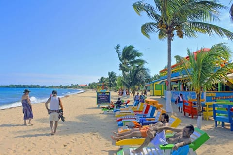 Beach nearby, white sand, beach towels