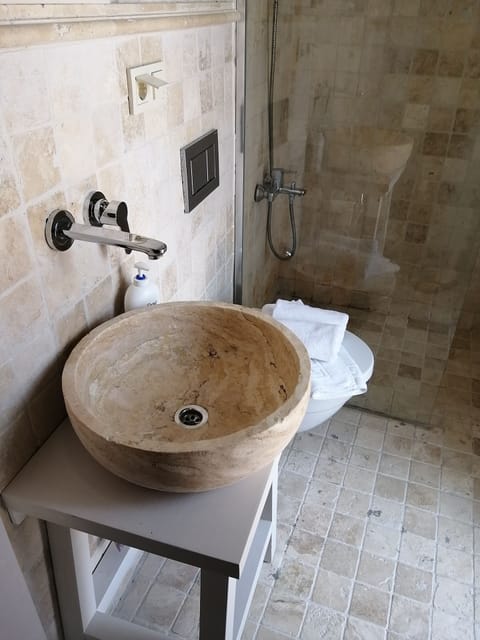 Shower, free toiletries, hair dryer, slippers