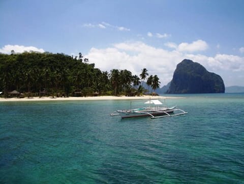 On the beach, white sand, sun loungers, snorkeling