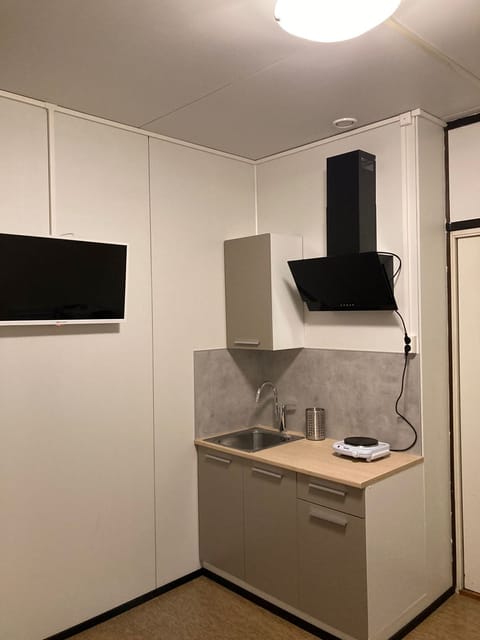 Economy Apartment | Private kitchen | Microwave, cleaning supplies, paper towels