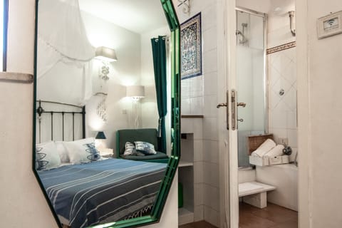 Luxury Triple Room, Terrace | Down comforters, minibar, in-room safe, individually decorated