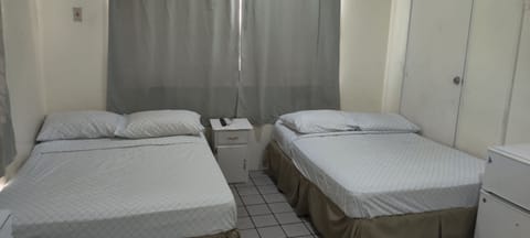 Economy Quadruple Room, 1 Bedroom | Soundproofing, iron/ironing board, free WiFi, bed sheets