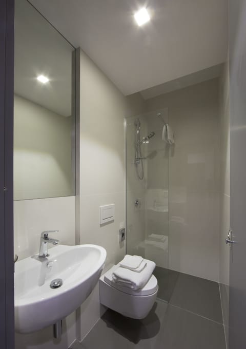 Capsule Single Room with Shared Bathroom | Bathroom | Shower, hair dryer, towels, toilet paper