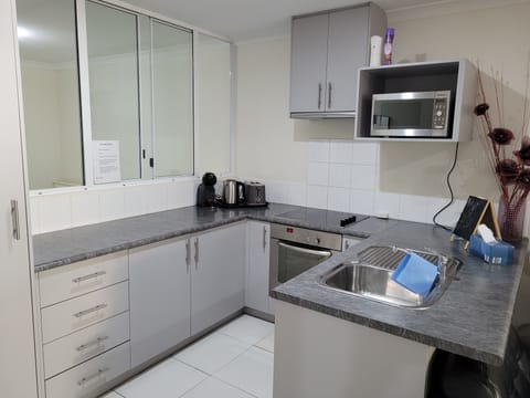 Standard Apartment, 2 Bedrooms | Shared kitchen facilities | Full-size fridge, microwave, oven, stovetop