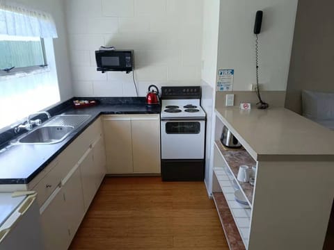 Family Studio Suite, 1 Bedroom, Kitchen, Garden Area | Private kitchen | Fridge, microwave, coffee/tea maker, electric kettle