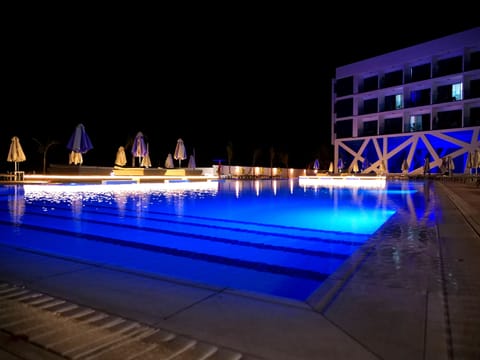 Indoor pool, seasonal outdoor pool, pool umbrellas, sun loungers