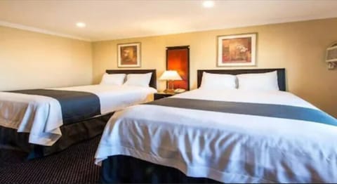 Family Room, 2 Queen Beds, Refrigerator & Microwave, City View | Desk, rollaway beds, free WiFi