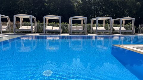 Outdoor pool, a heated pool, sun loungers