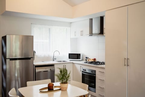 Self Contained Apartment #8 Top Floor | Private kitchen | Full-size fridge, oven, stovetop, dishwasher