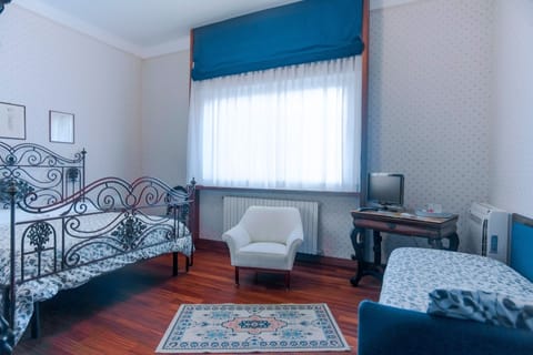 Family Triple Room, Park View | Premium bedding, memory foam beds, minibar, desk