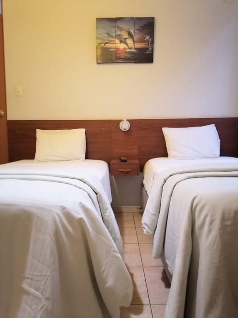 Economy Room, 2 Twin Beds | Iron/ironing board, free WiFi, bed sheets