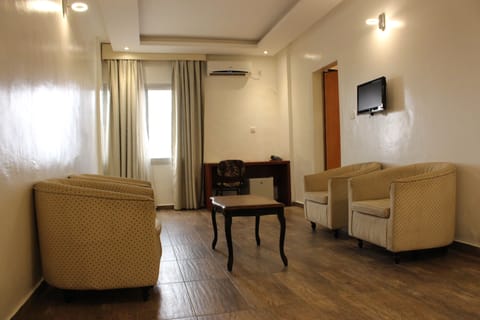 Apartment, 1 Bedroom | Living room | Flat-screen TV