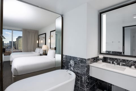 Deluxe Room, 2 Queen Beds | Bathroom | Designer toiletries, hair dryer, bathrobes, towels