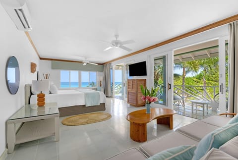 Beachfront Suite | Living area | 40-inch flat-screen TV with digital channels, TV