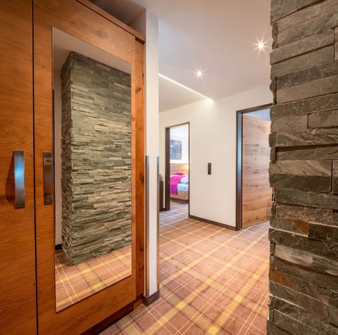 Family Suite | Living area | Flat-screen TV, heated floors