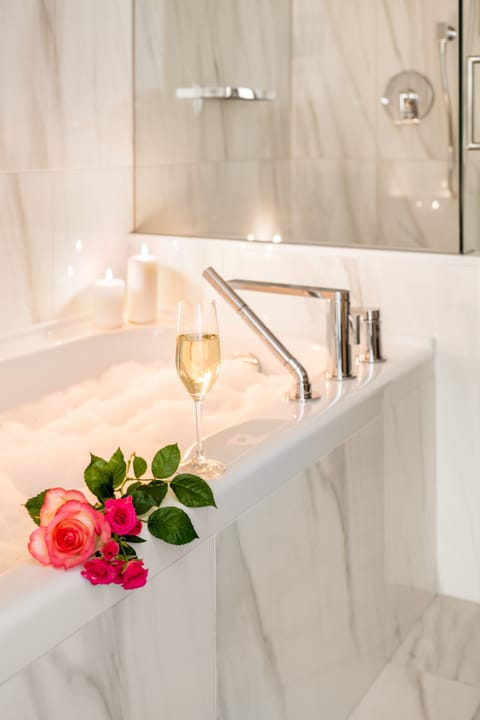 Designer toiletries, hair dryer, bathrobes, slippers