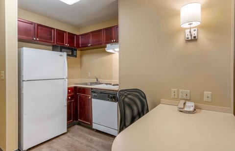 Suite, 1 King Bed with Sofa bed, Non Smoking | Private kitchen | Full-size fridge, microwave, stovetop, dishwasher