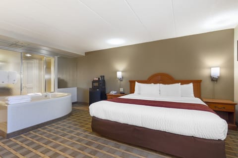 Suite Room with 1 King Bed - Non-Smoking | Desk, blackout drapes, iron/ironing board, free WiFi