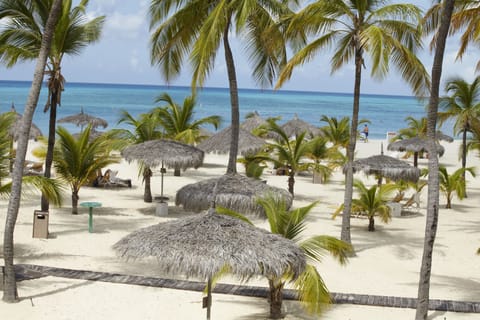 On the beach, white sand, free beach cabanas, sun loungers