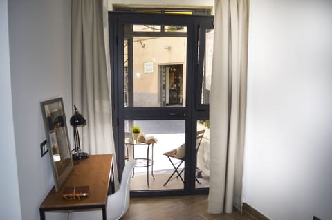 Exclusive Loft, Accessible | Living area | 28-inch flat-screen TV with cable channels, TV