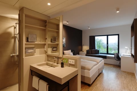 Eco-friendly toiletries, hair dryer, towels