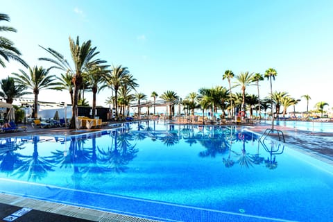 3 outdoor pools, open 9:00 AM to 6:00 PM, pool umbrellas, sun loungers