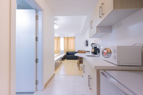 Economy Condo, Refrigerator & Microwave | Private kitchenette | Fridge, microwave, electric kettle