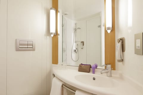 Shower, eco-friendly toiletries, hair dryer, towels