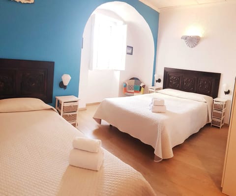 Standard Triple Room, Private Bathroom | Individually decorated, rollaway beds, free WiFi, bed sheets