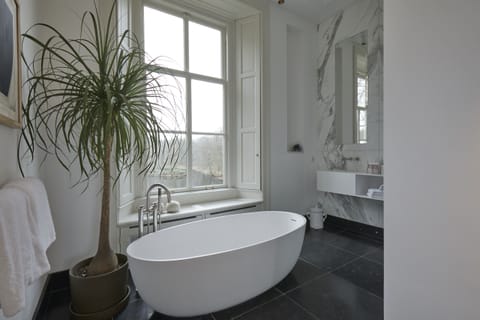 Terrace Suite | Bathroom | Rainfall showerhead, designer toiletries, hair dryer, bathrobes