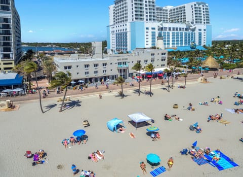 On the beach, white sand, sun loungers, beach umbrellas