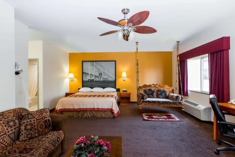 Suite, 1 King Bed, Refrigerator | Desk, blackout drapes, iron/ironing board, free WiFi