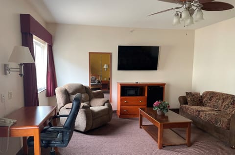 Suite, 1 King Bed, Refrigerator | Desk, blackout drapes, iron/ironing board, free WiFi