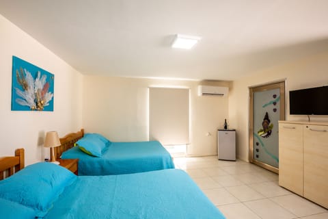 Double Room, Partial Ocean View | Blackout drapes, soundproofing, iron/ironing board, free WiFi