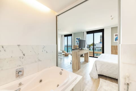 Junior Suite, Beachside | Minibar, in-room safe, desk, soundproofing