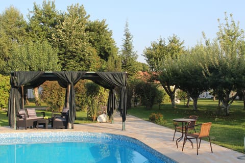 Seasonal outdoor pool, pool umbrellas, sun loungers