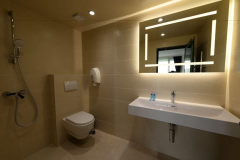 Family Suite, Balcony | Bathroom | Combined shower/tub, free toiletries, slippers, towels