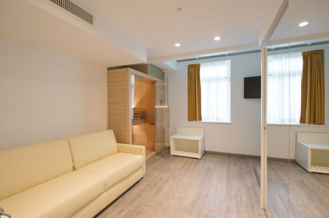 Family Suite, Sauna | Living area | 39-inch flat-screen TV with satellite channels, TV