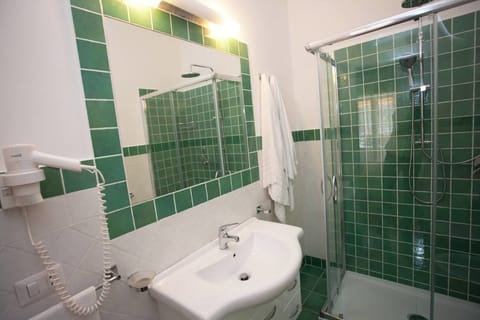 Suite, Non Smoking, Balcony | Bathroom | Shower, free toiletries, hair dryer, bathrobes