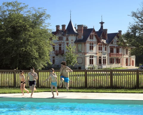 Seasonal outdoor pool, open 10 AM to 7 PM, pool umbrellas, sun loungers