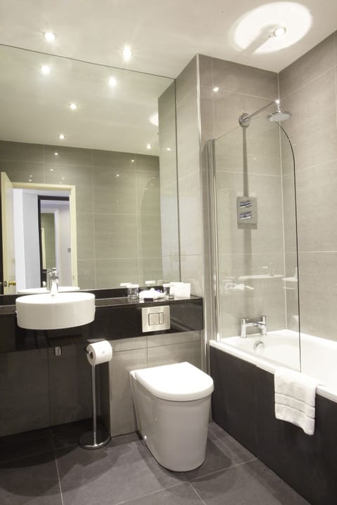 Designer toiletries, hair dryer, bathrobes, slippers