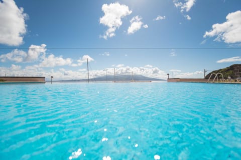 Indoor pool, outdoor pool, pool umbrellas, sun loungers