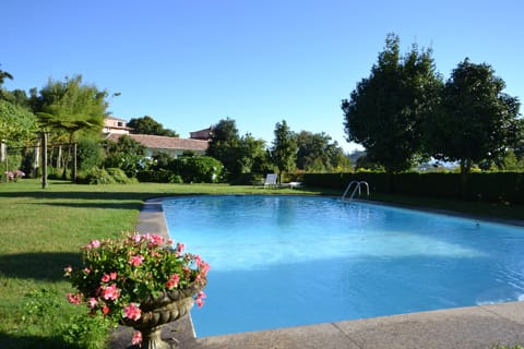 Seasonal outdoor pool, pool umbrellas, sun loungers