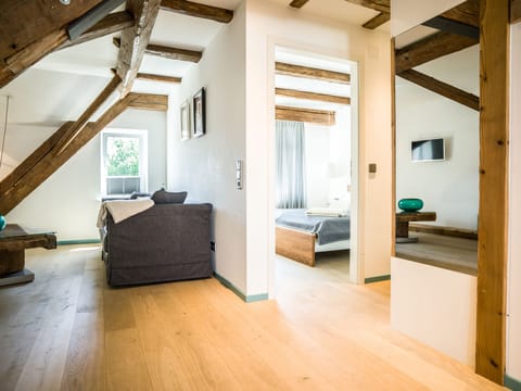 Junior Suite, Balcony | Living area | Flat-screen TV